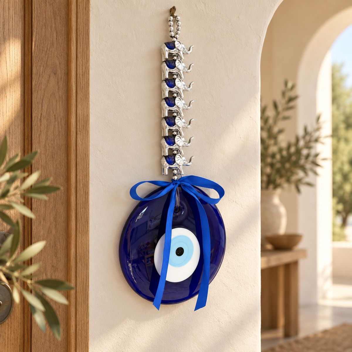 Turkish evil eye and elephant wall hanging displayed in an entrance setting