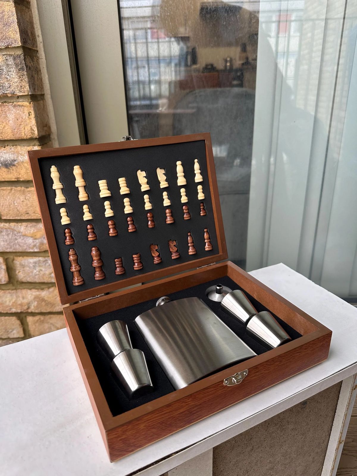 Wooden chess set silver flask angle.