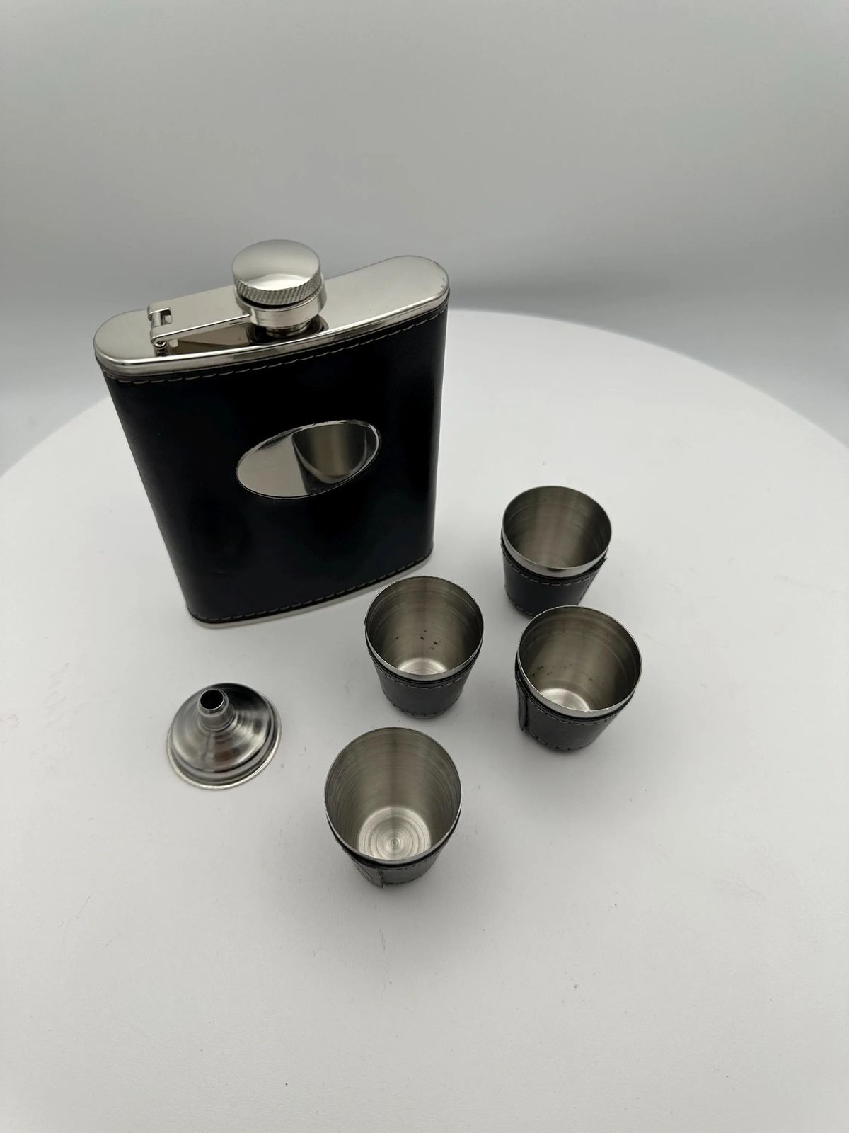 Black leather flask shot cups.