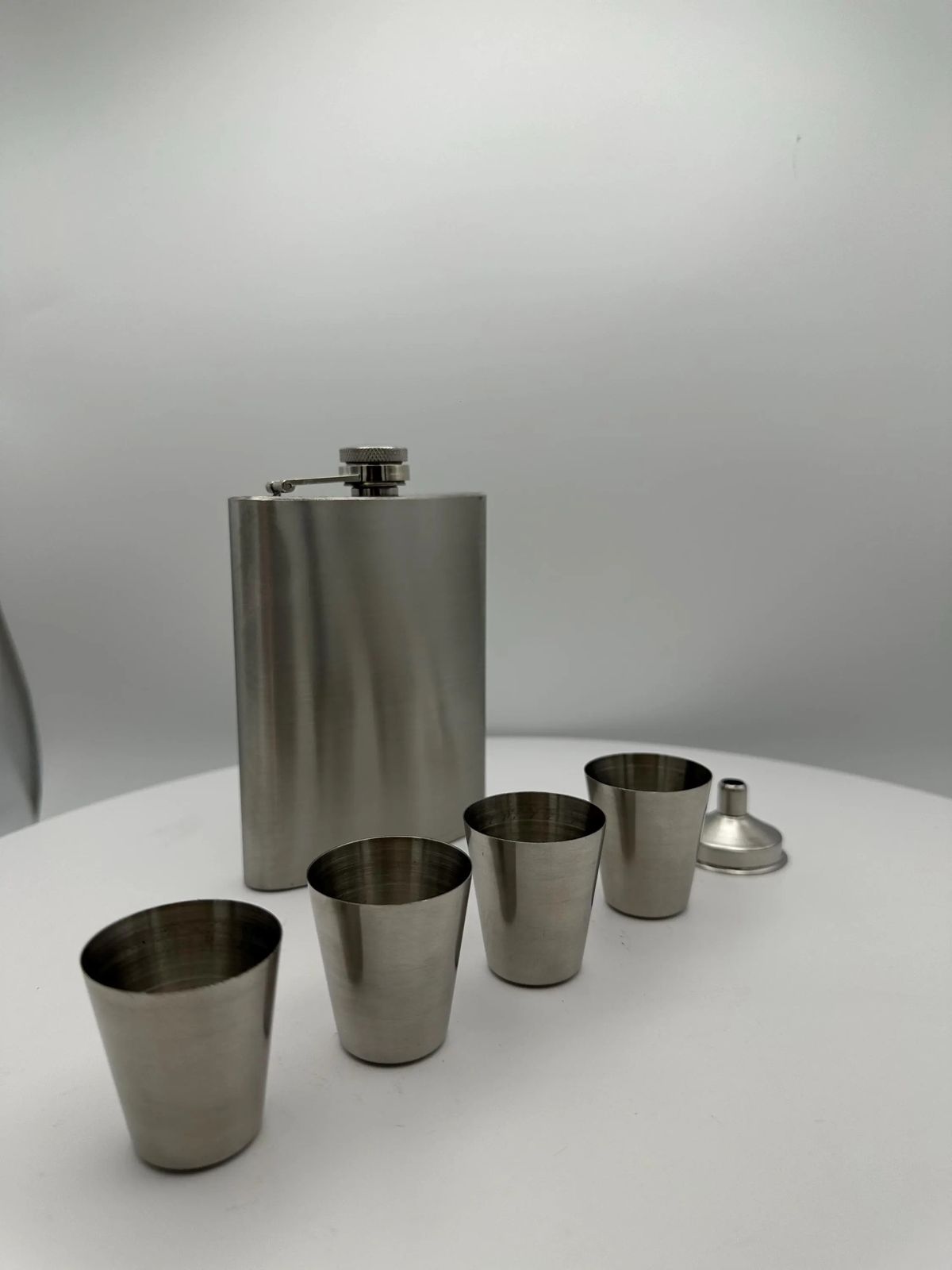 Silver flask shot cups set.