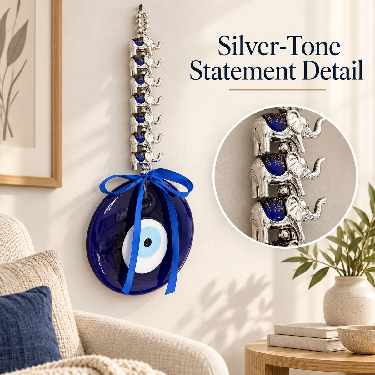 Close-up of the silver-tone elephant detail below the blue glass eye